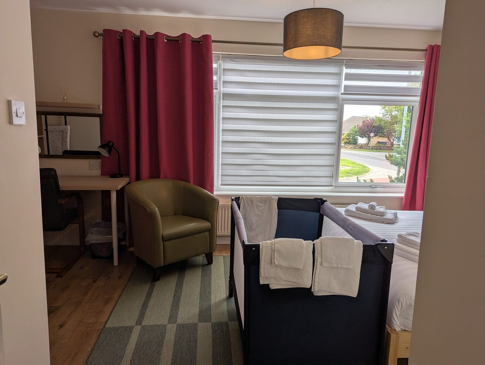 Bedroom 1 cot from doorway