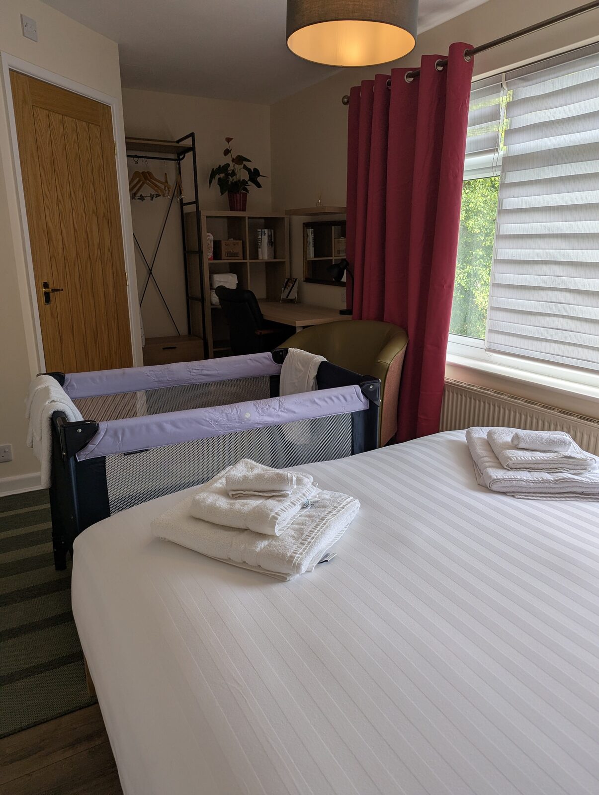 Bedroom 1 cot and bed