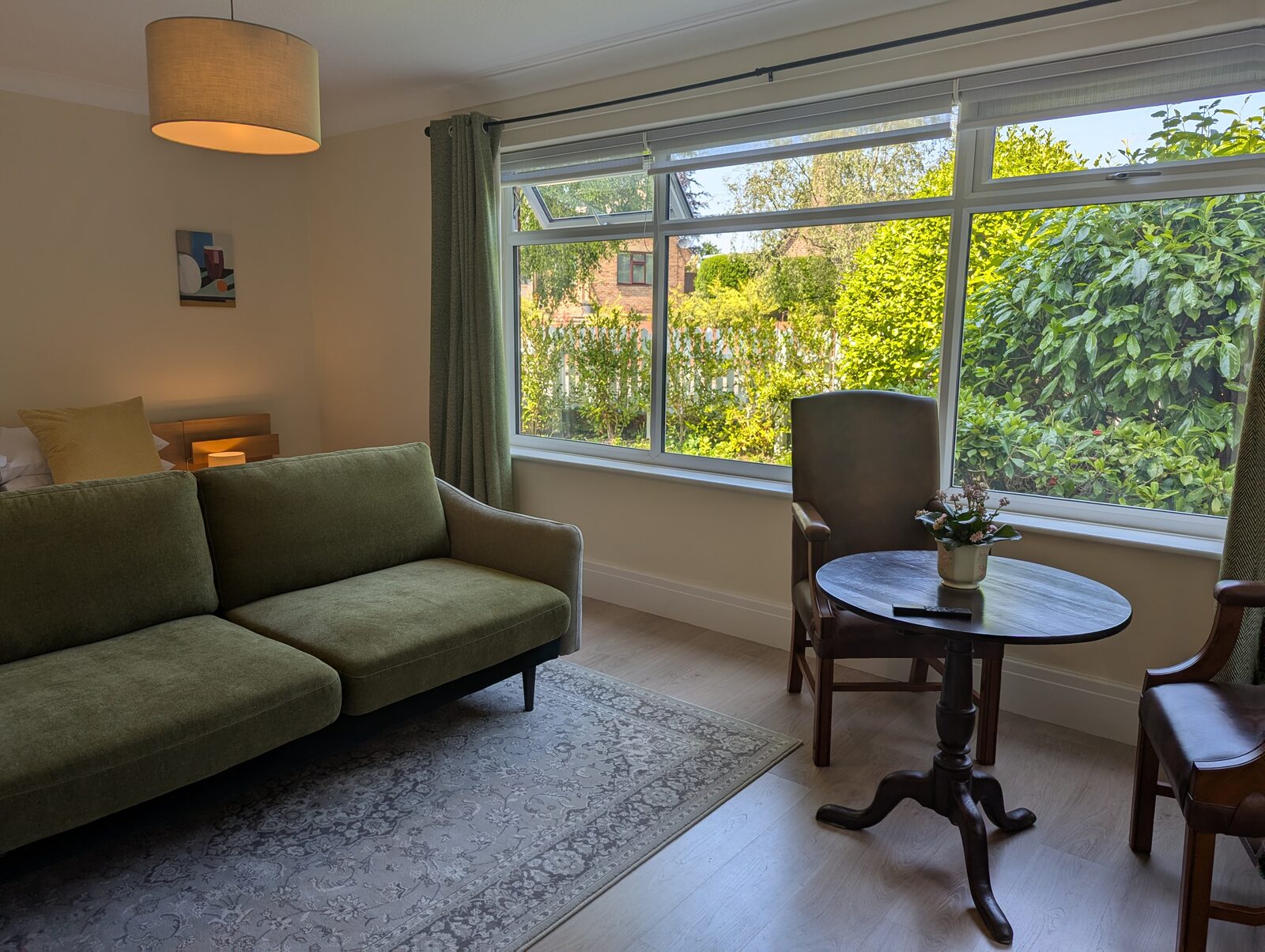 Bedroom 5 sofa and table with view of garden