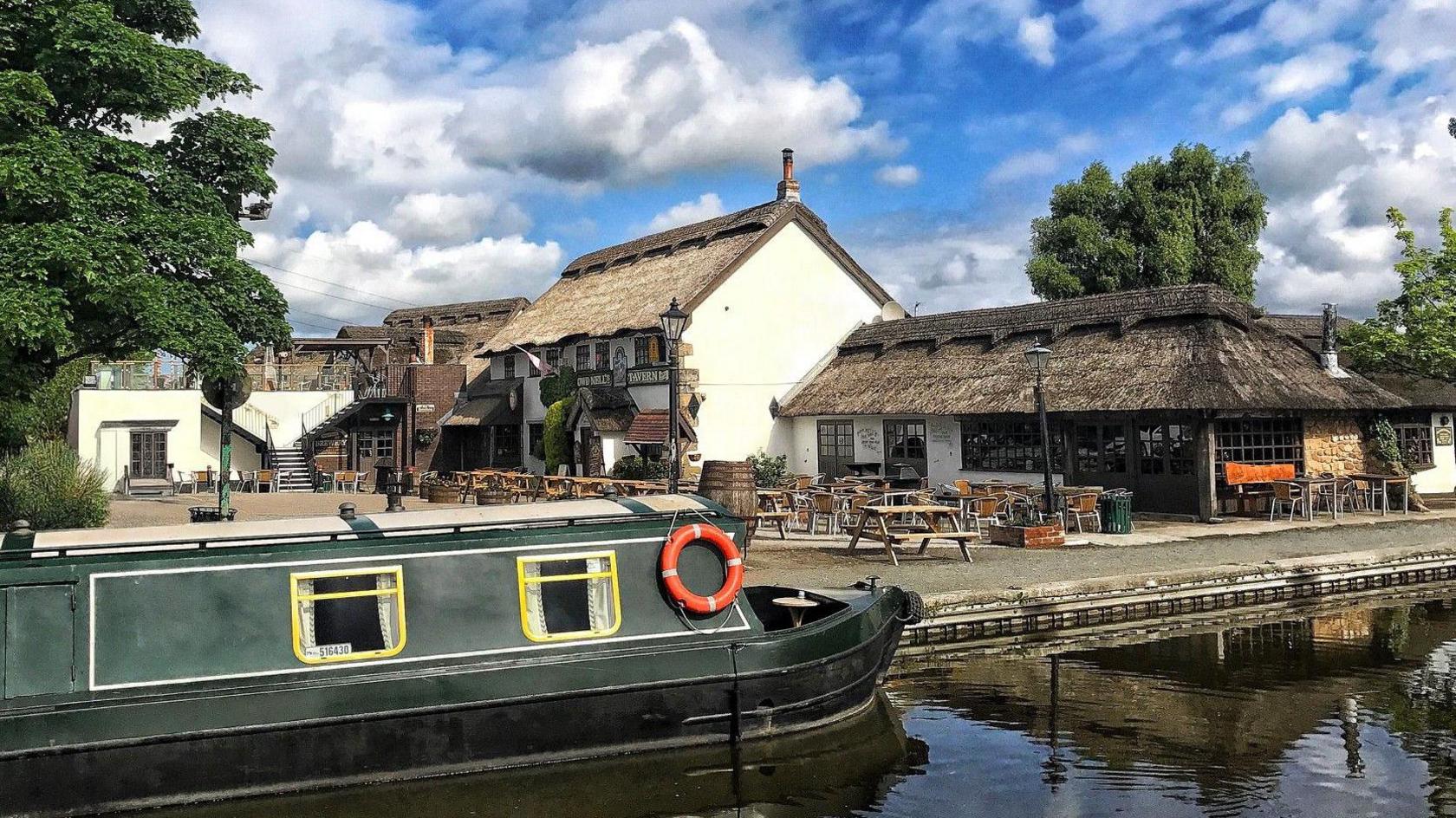 Guy's Thatched Hamlet, Bilsborrow — canal boat and thatched buildings